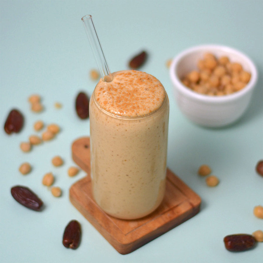 Peanut butter and date shake in a tall glass